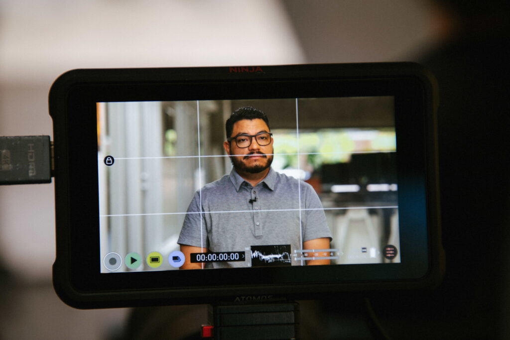 Filming a customer testimonial for a SaaS video production.