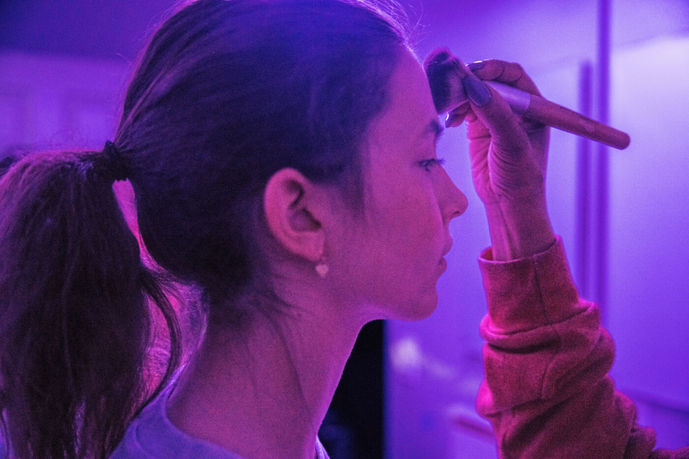 Close-up of talent in makeup before a digital and social campaign shoot